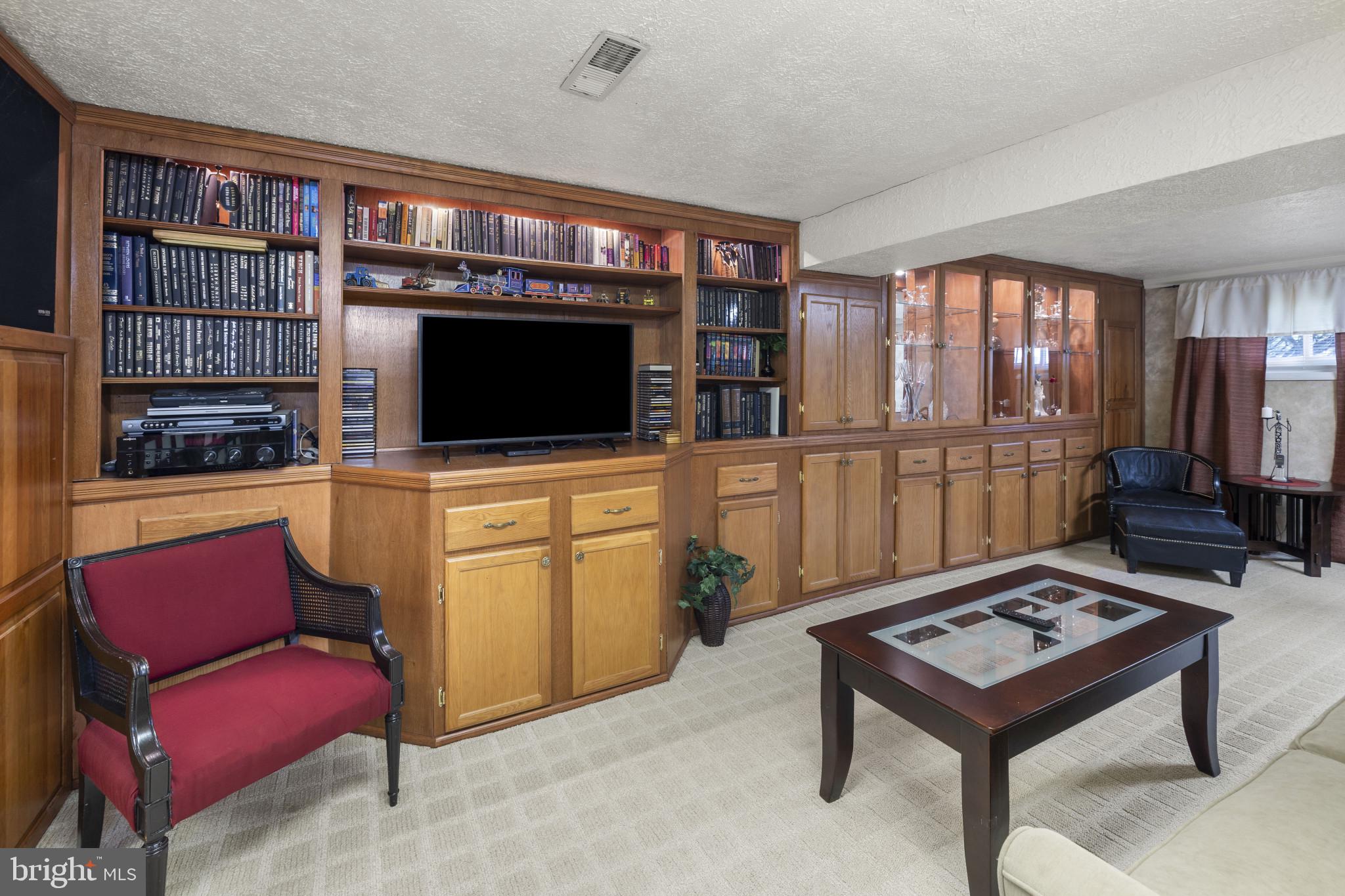 4105 Hanwell Road Randallstown, MD 21133 - Photo 10 of 37 a living room with furniture and a flat screen tv