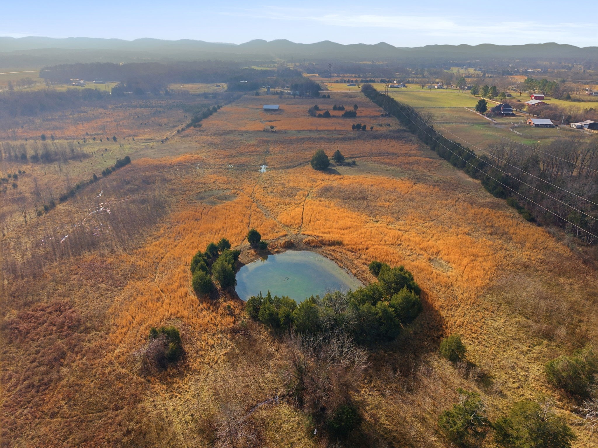 4689 Sledge Road Christiana, TN 37037 - Photo 13 of 32 a view of a lake with beach and mountain view