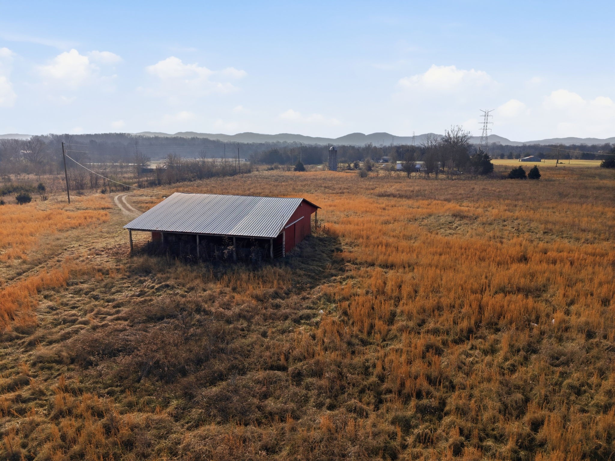 4689 Sledge Road Christiana, TN 37037 - Photo 4 of 32 a view of a lake with houses in front of it