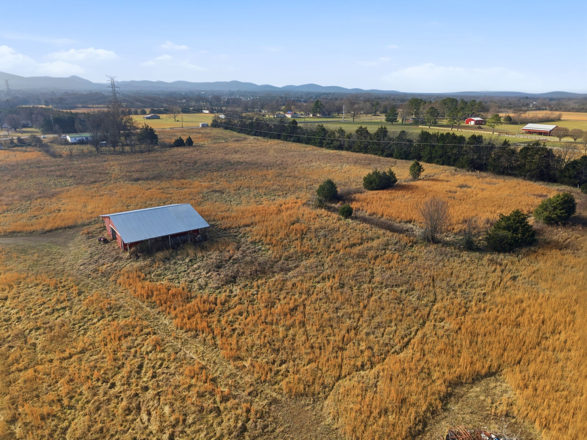 4689 Sledge Road Christiana, TN 37037 - Photo 10 of 32 a view of a lake with houses in the back