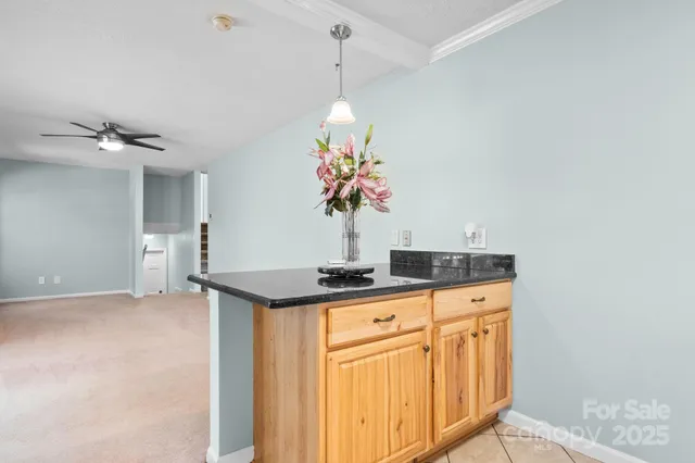 a view of a room with gym equipment and a large window