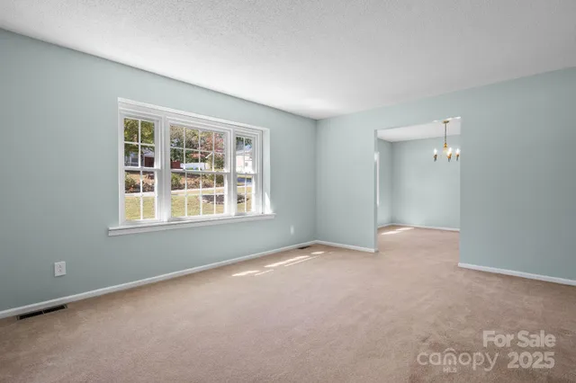 a kitchen with stainless steel appliances granite countertop a sink dishwasher a microwave oven a stove with granite countertops and cabinets