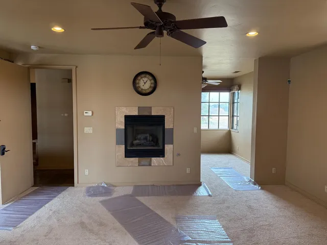 a living room with a large bed and a large window