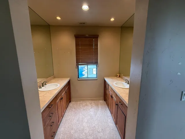 a bathroom with a sink a washer and dryer