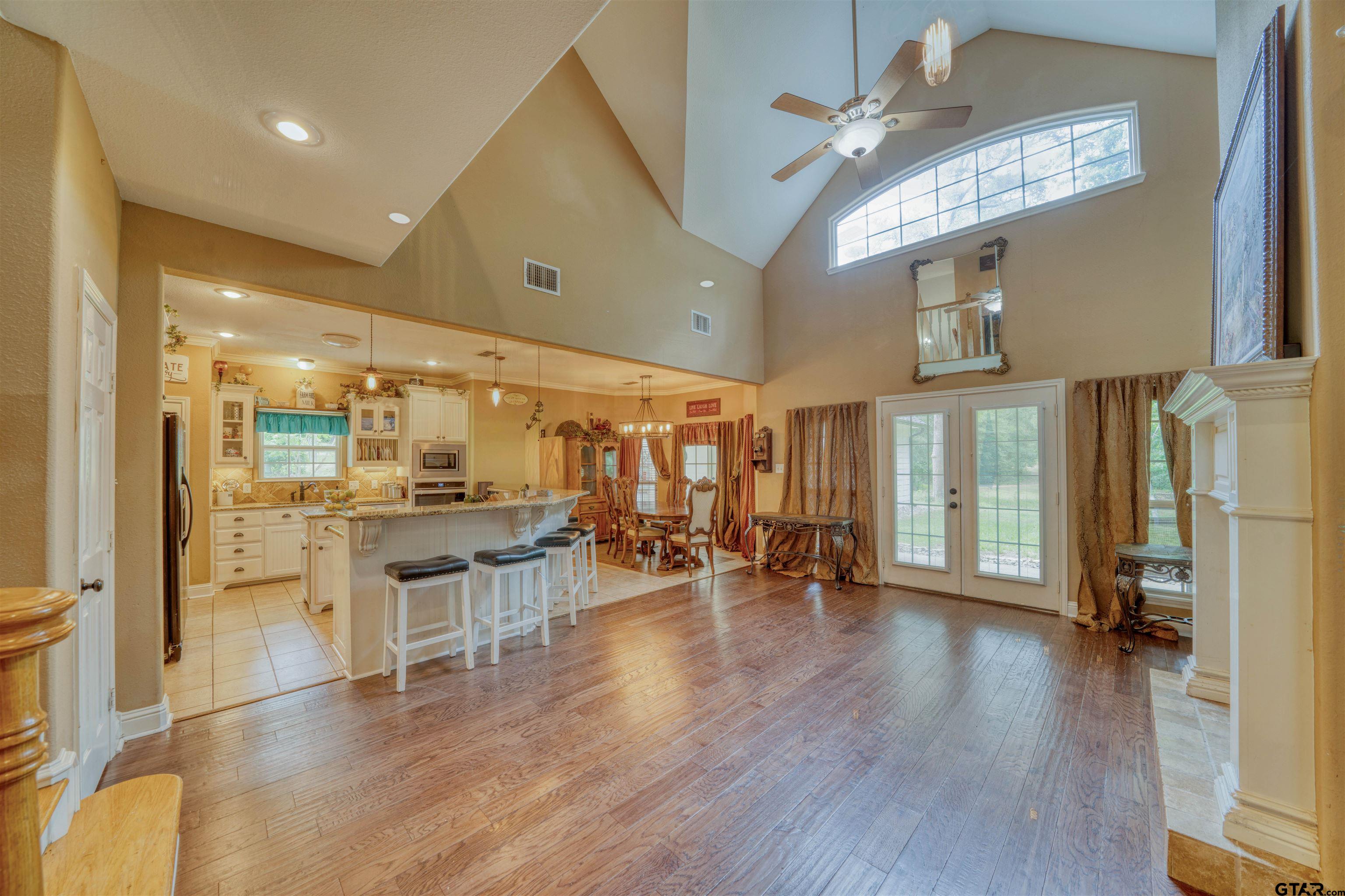 1776 Mustang Road Gilmer, TX 75645 - Photo 26 of 45 a view of a room with lots of wooden furniture and a large window