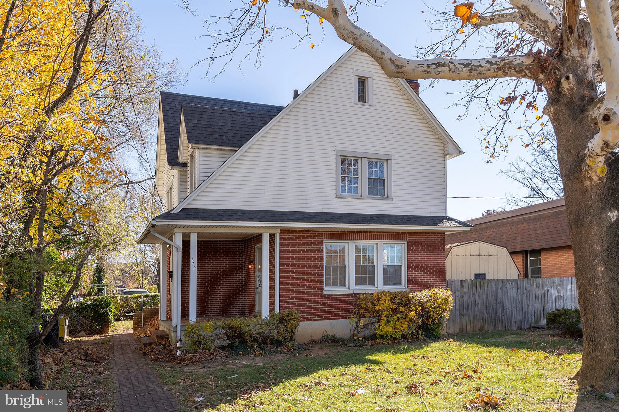 675 Berryville Avenue Winchester, VA 22601 - Photo 1 of 32 a front view of a house with a yard and garage