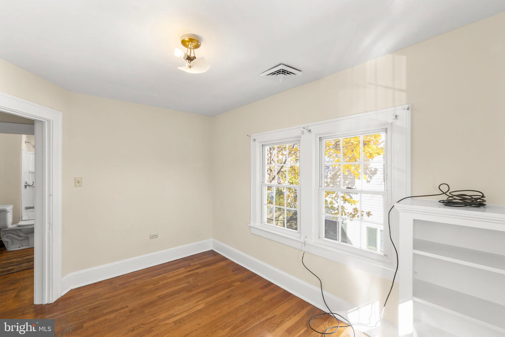 675 Berryville Avenue Winchester, VA 22601 - Photo 21 of 32 a view of an empty room with a window