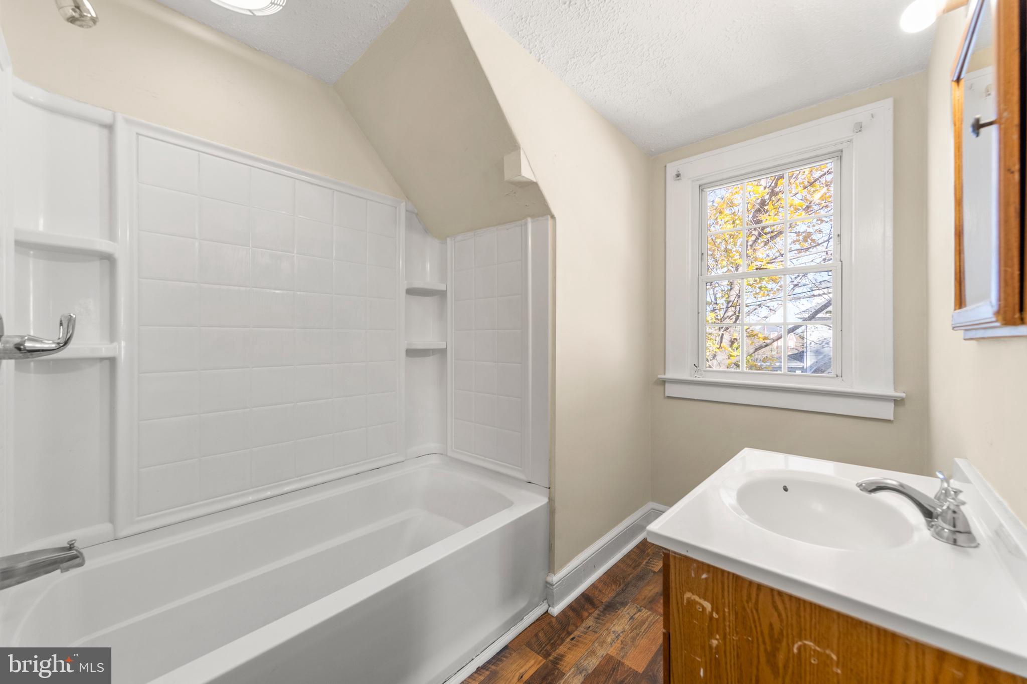 675 Berryville Avenue Winchester, VA 22601 - Photo 25 of 32 a bathroom with a tub sink and window