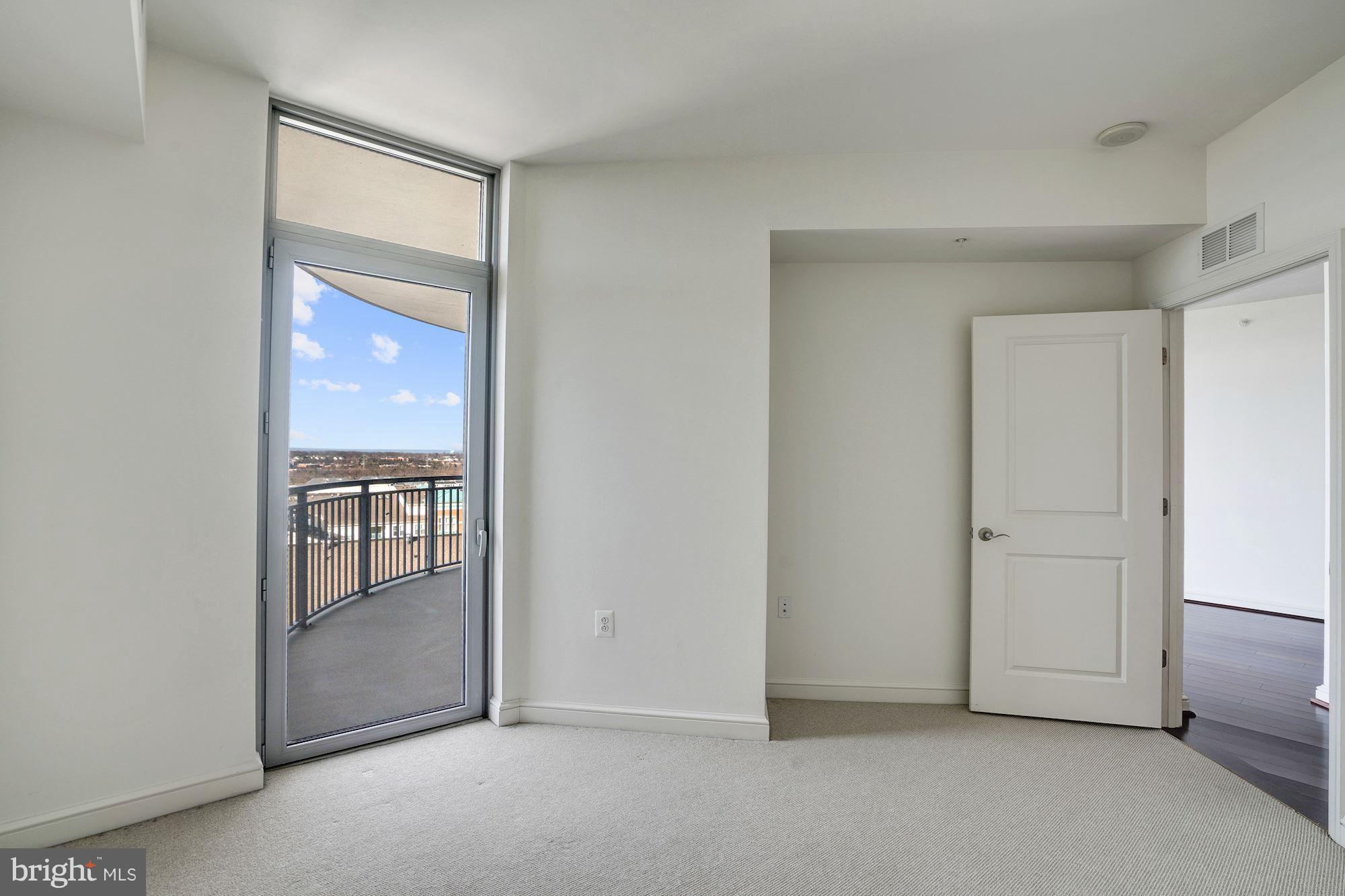 11990 Market Street, Unit 713 Reston, VA 20190 - Photo 21 of 30 a view of an empty room and window