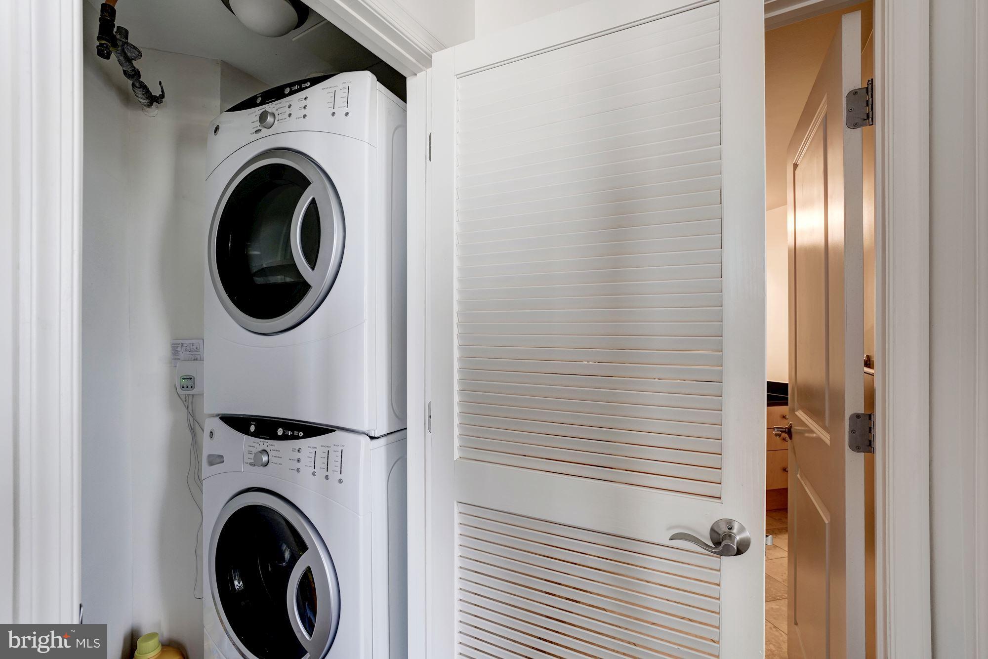 11990 Market Street, Unit 713 Reston, VA 20190 - Photo 23 of 30 a utility room with dryer and washer