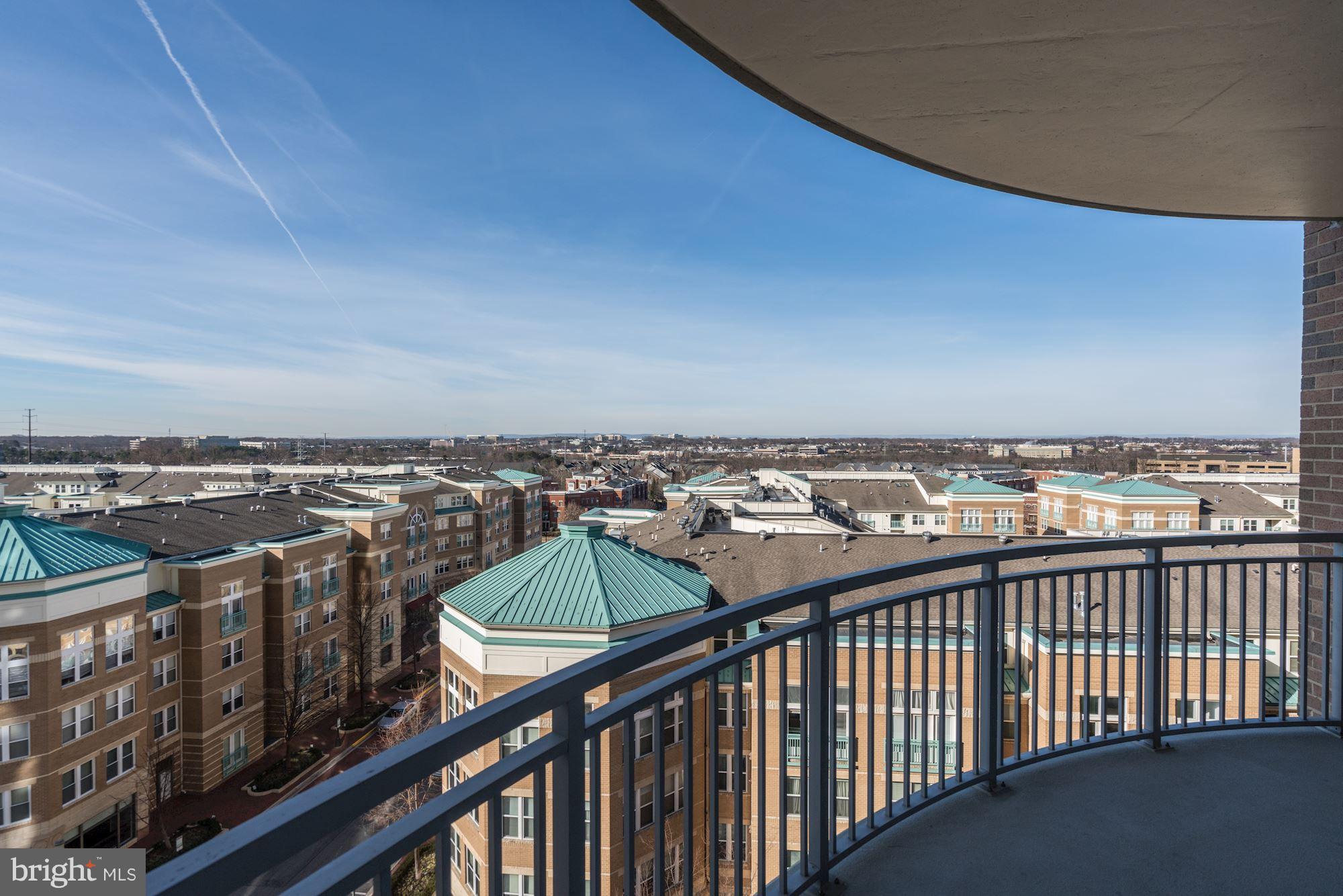 11990 Market Street, Unit 713 Reston, VA 20190 - Photo 10 of 30 a view of a city skyline from a balcony