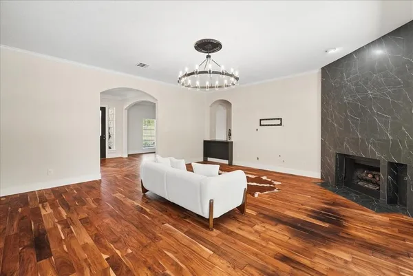 a kitchen with stainless steel appliances granite countertop a sink a stove and a refrigerator
