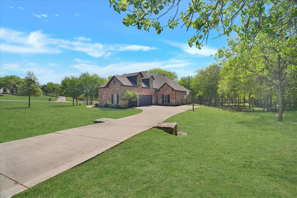101 Deer Crossing Way Azle, TX 76020 - Photo 2 of 40 a view of a house with a big yard