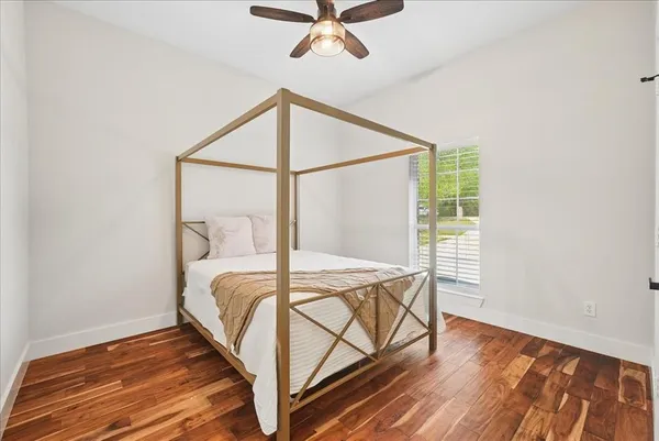 a room with pool table and windows