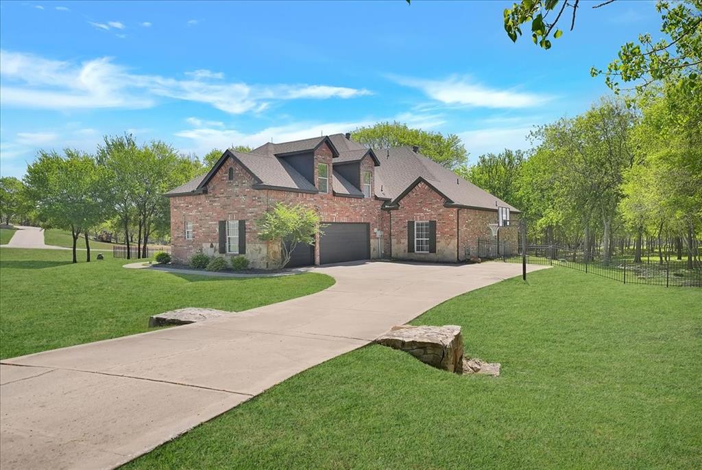 101 Deer Crossing Way Azle, TX 76020 - Photo 4 of 40 a house view with a garden space