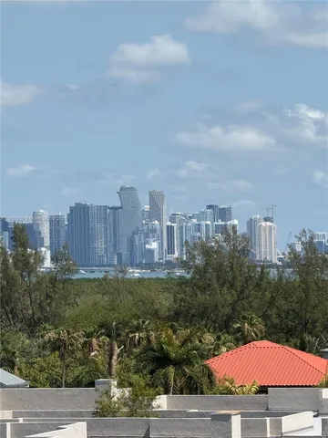 an aerial view of a residential apartment building with a yard