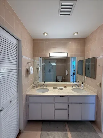 a bathroom with a shower and toilet