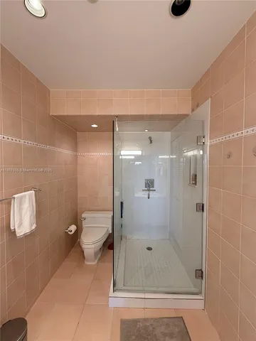 a bedroom with two beds and a couch