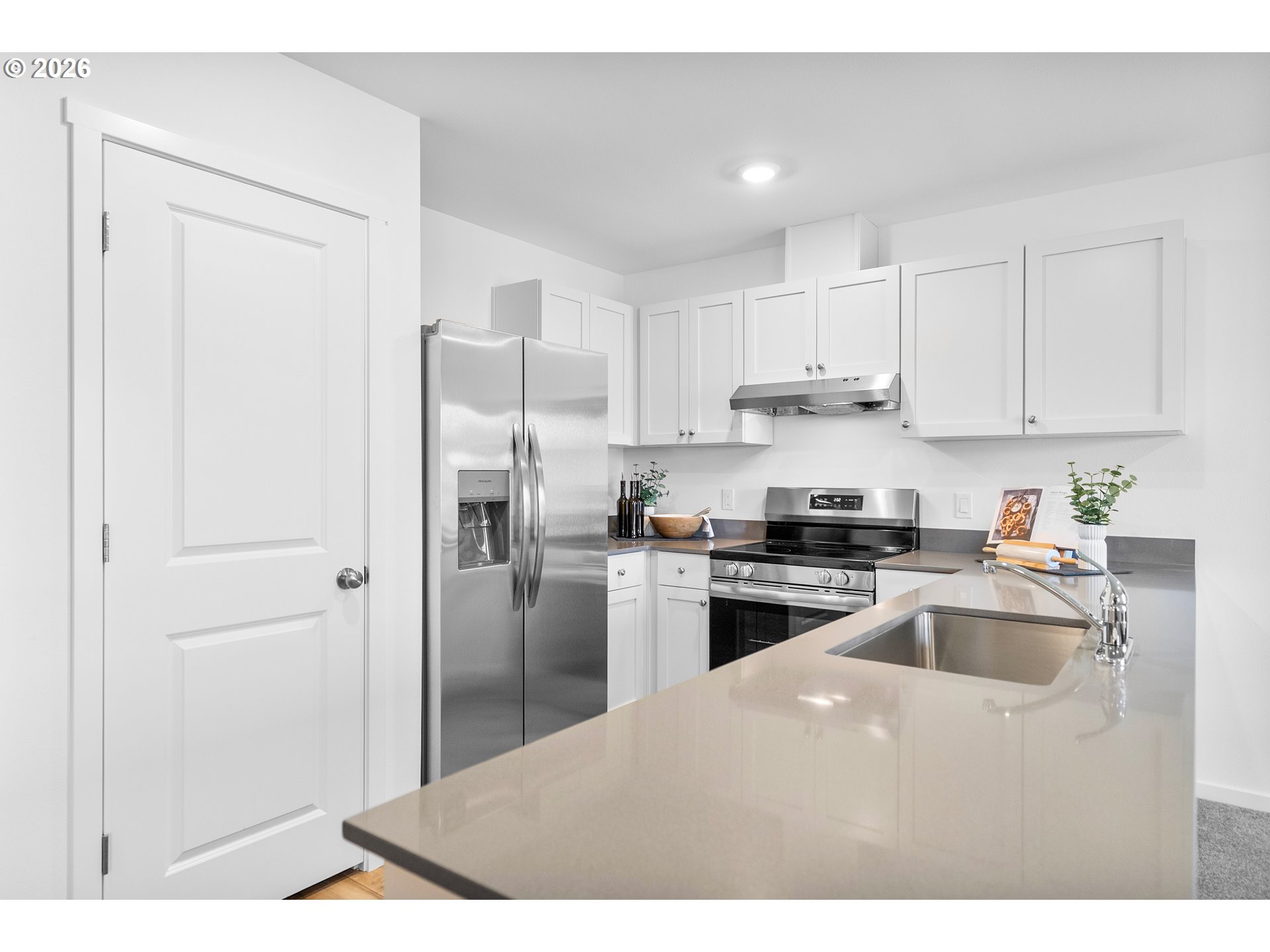25263 Tanglewood Way Veneta, OR 97487 - Photo 21 of 28 a kitchen with kitchen island a sink stainless steel appliances and refrigerator