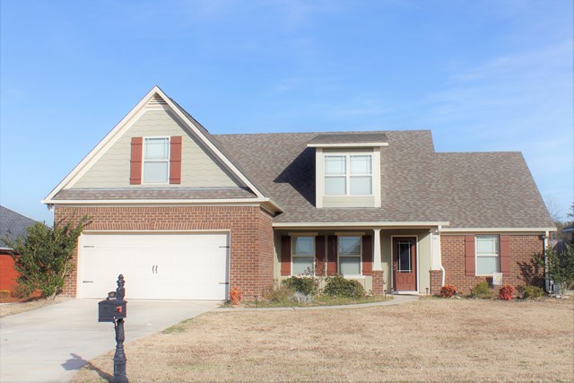 2141 Lee Road Phenix City, AL 36870 - Photo 1 of 24 a front view of a house with a yard