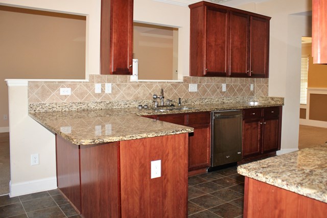 2141 Lee Road Phenix City, AL 36870 - Photo 14 of 24 a bathroom with a granite countertop sink and a mirror