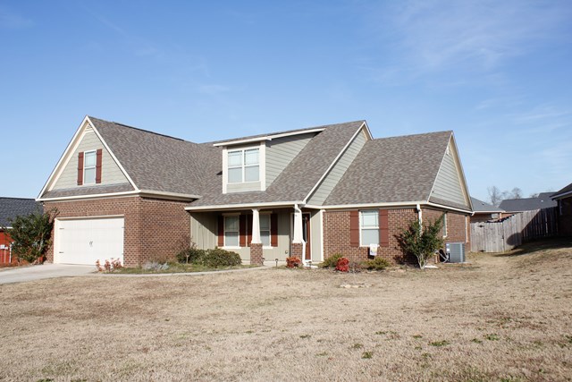 2141 Lee Road Phenix City, AL 36870 - Photo 2 of 24 front view of a house with a yard