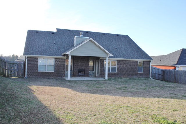 2141 Lee Road Phenix City, AL 36870 - Photo 23 of 24 a front view of a house with a yard