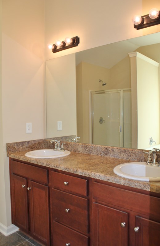 2141 Lee Road Phenix City, AL 36870 - Photo 9 of 24 a bathroom with a granite countertop sink and a mirror