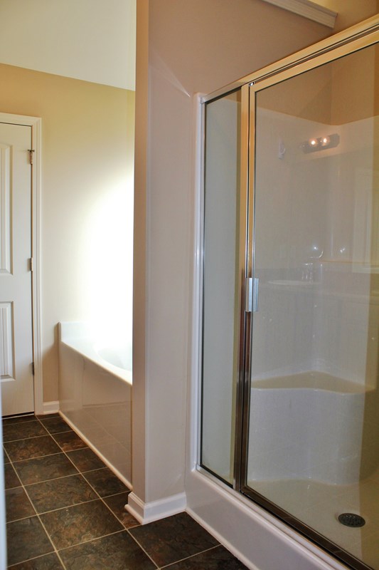 2141 Lee Road Phenix City, AL 36870 - Photo 10 of 24 a bathroom with a shower and a glass door