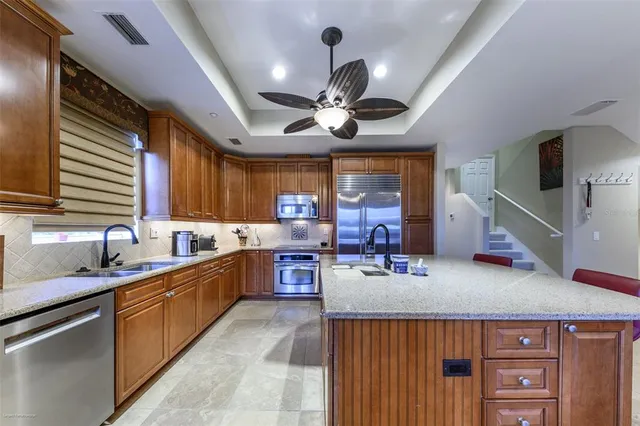 a living room with furniture fireplace and a large window