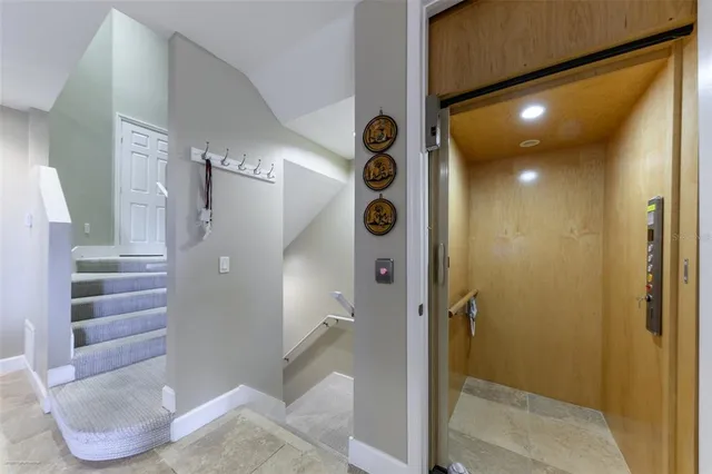 a bathroom with a granite countertop toilet a sink and a mirror