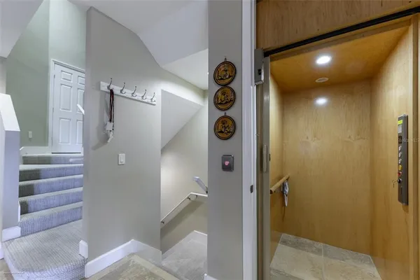 a bathroom with a granite countertop sink a mirror and shower