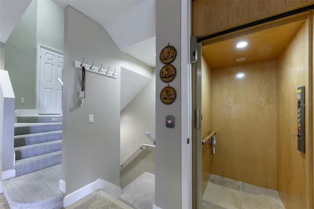 a bathroom with a granite countertop sink a mirror and shower