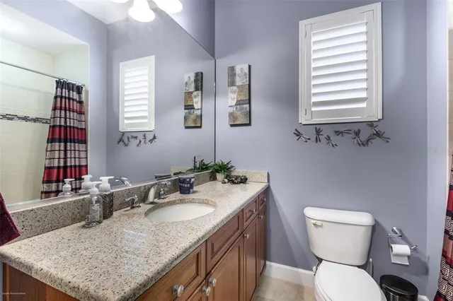 a spacious bathroom with a tub shower and window