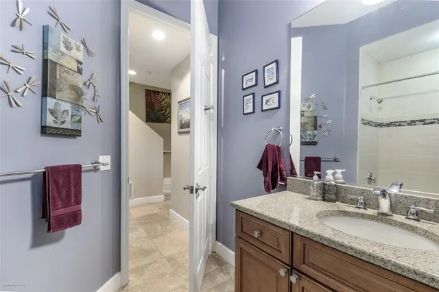 a spacious bathroom with a double vanity sink and a mirror