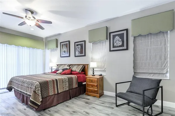 a bed room with a bed and a chandelier