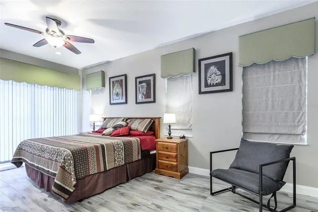 a bed room with a bed and a chandelier