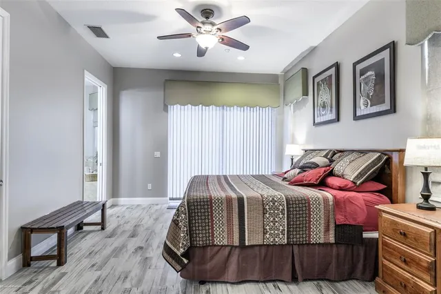 a bed room with a bed and a television