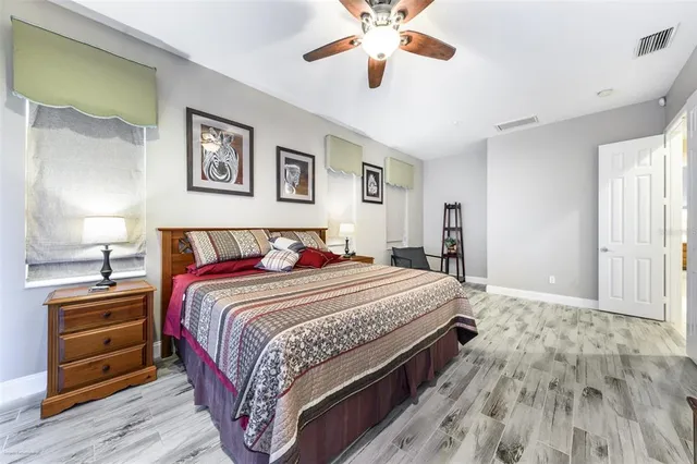 a bathroom with a sink vanity mirror and toilet
