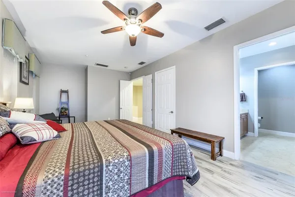 a bedroom with a bed and glass window