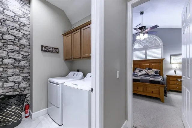 a view of a patio with a dining table and chairs with wooden floor