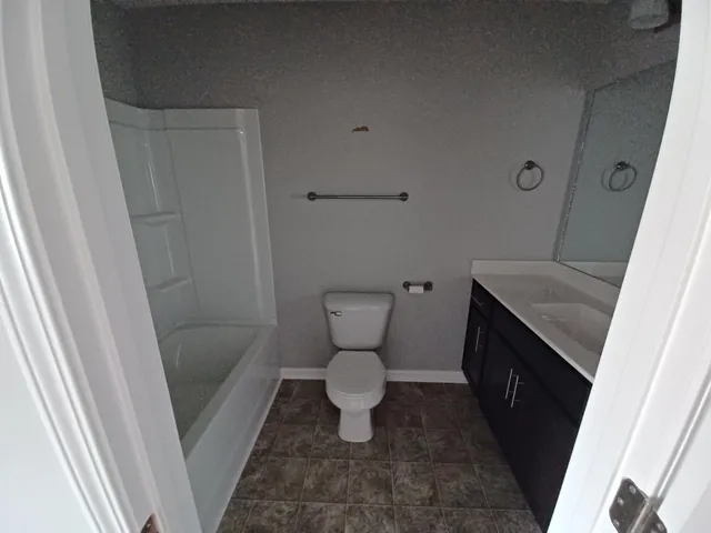 a bathroom with a toilet and a sink