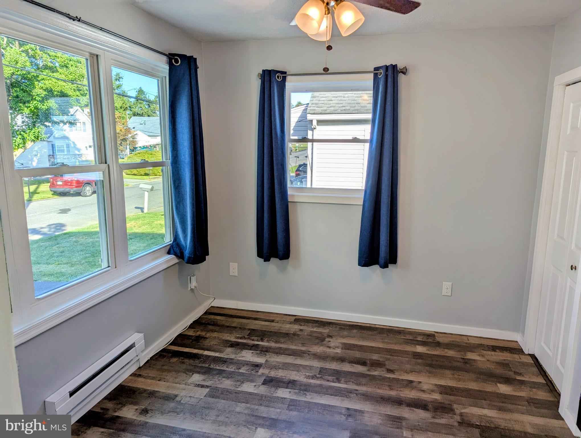 4917 Shepherd Street Brookhaven, PA 19015 - Photo 13 of 34 a view of empty room with window and chandelier