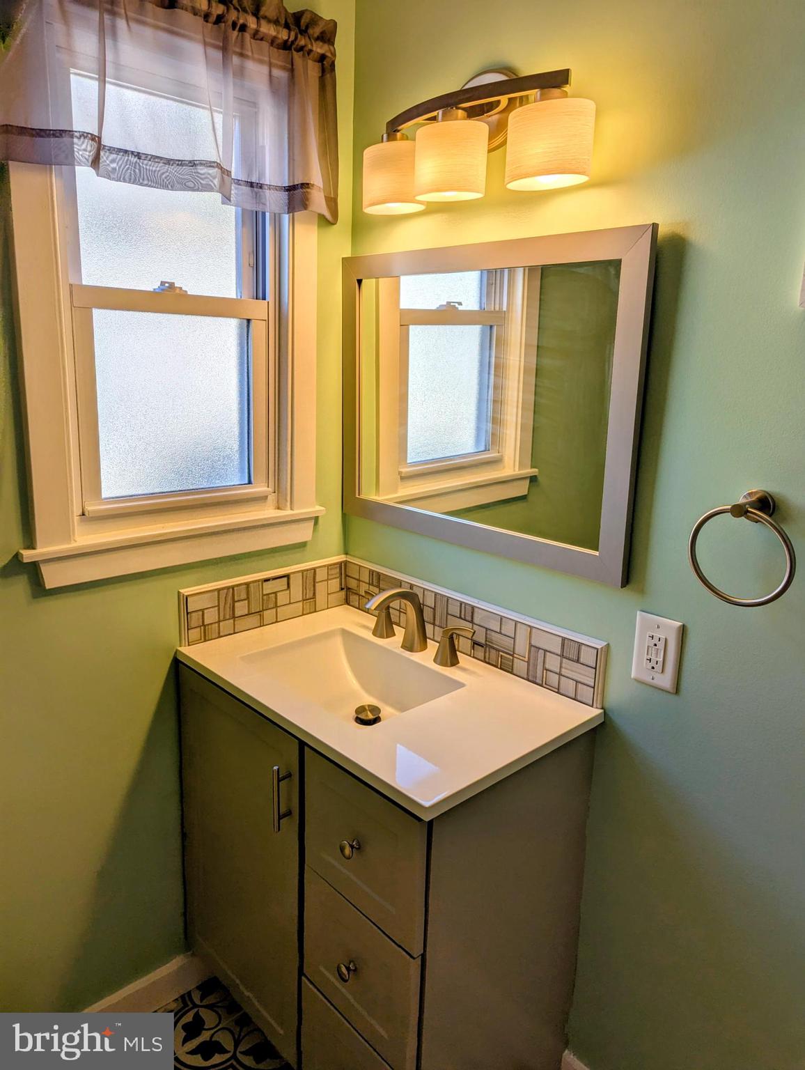4917 Shepherd Street Brookhaven, PA 19015 - Photo 17 of 34 a bathroom with a sink and a mirror