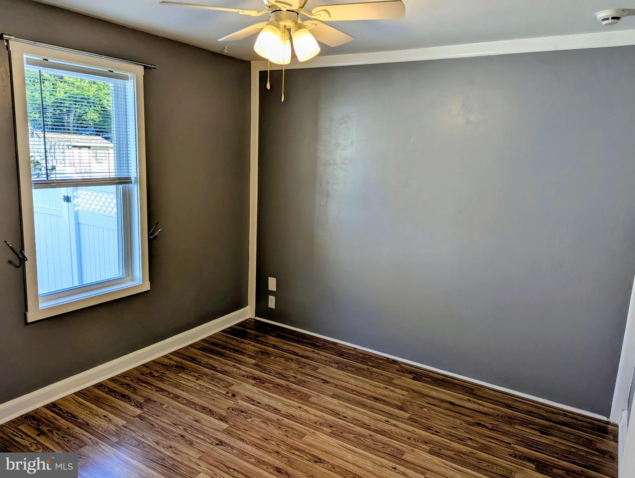 4917 Shepherd Street Brookhaven, PA 19015 - Photo 19 of 34 a view of empty room with wooden floor and fan