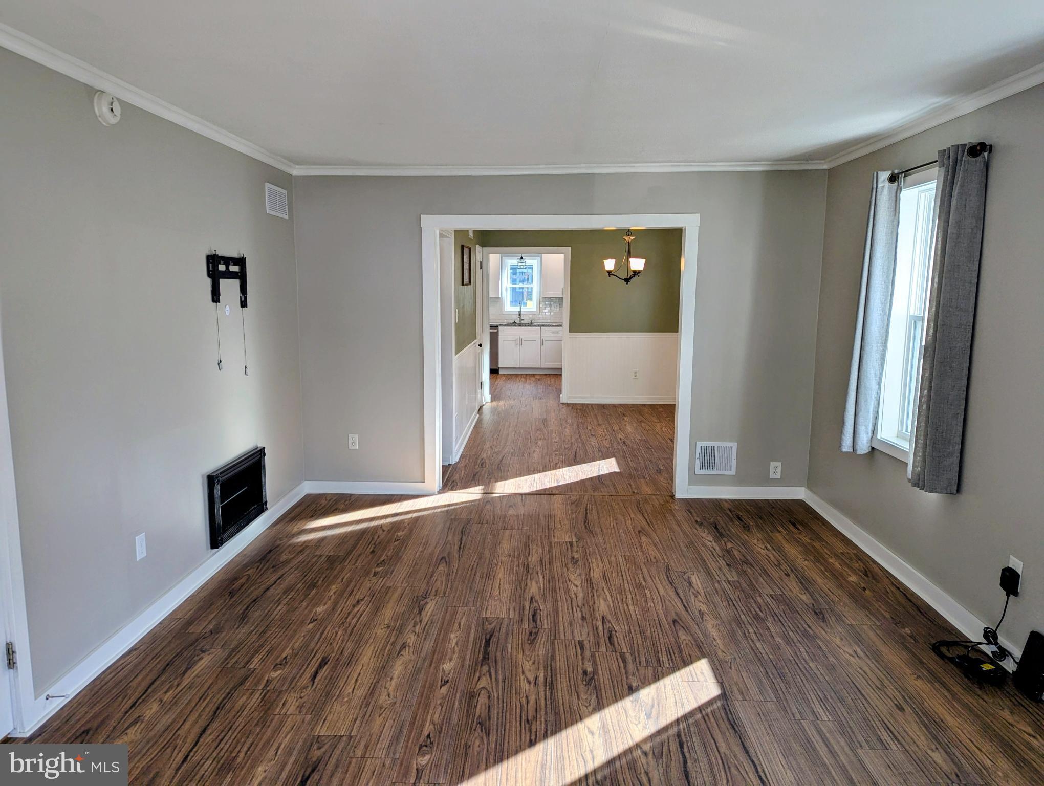 4917 Shepherd Street Brookhaven, PA 19015 - Photo 3 of 34 wooden floor in an empty room with a window