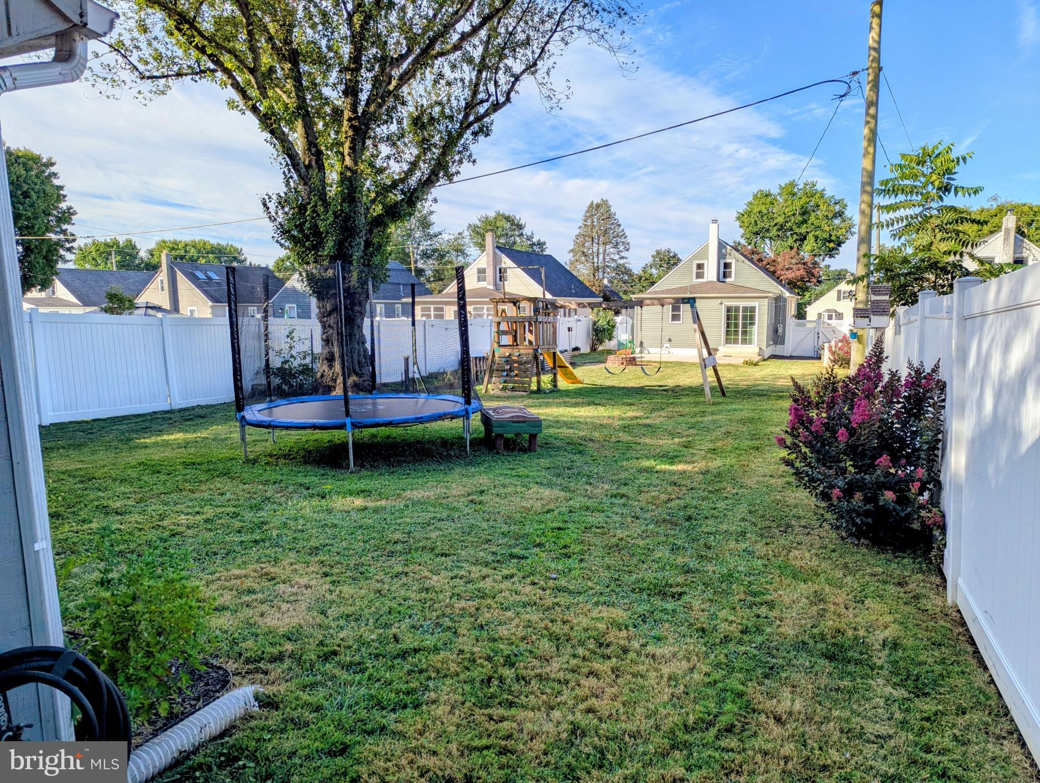 4917 Shepherd Street Brookhaven, PA 19015 - Photo 33 of 34 a view of a house with a yard and a garden