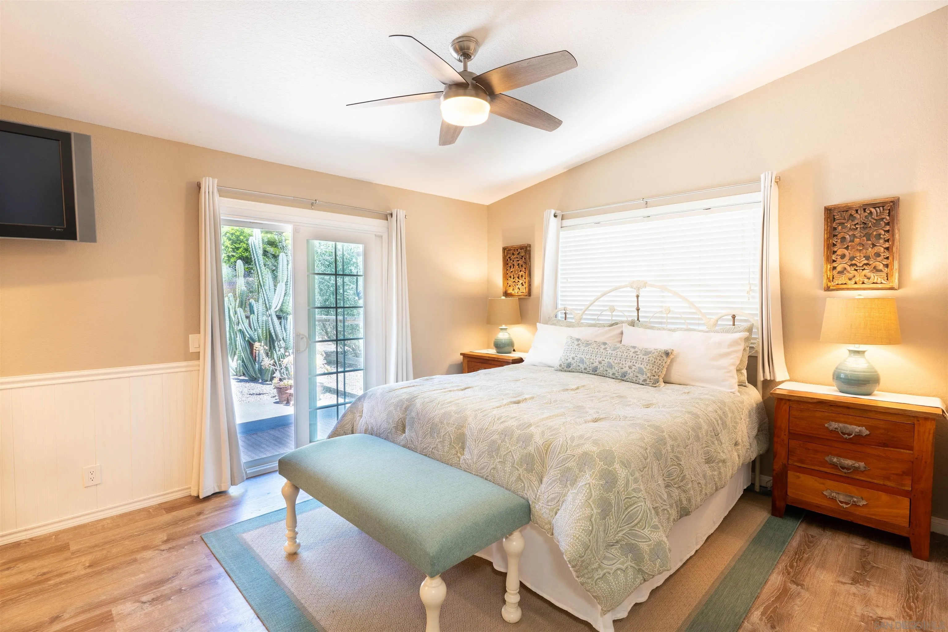 1045 Capra Way Fallbrook, CA 92028 - Photo 16 of 44 a bedroom with a bed and a tv