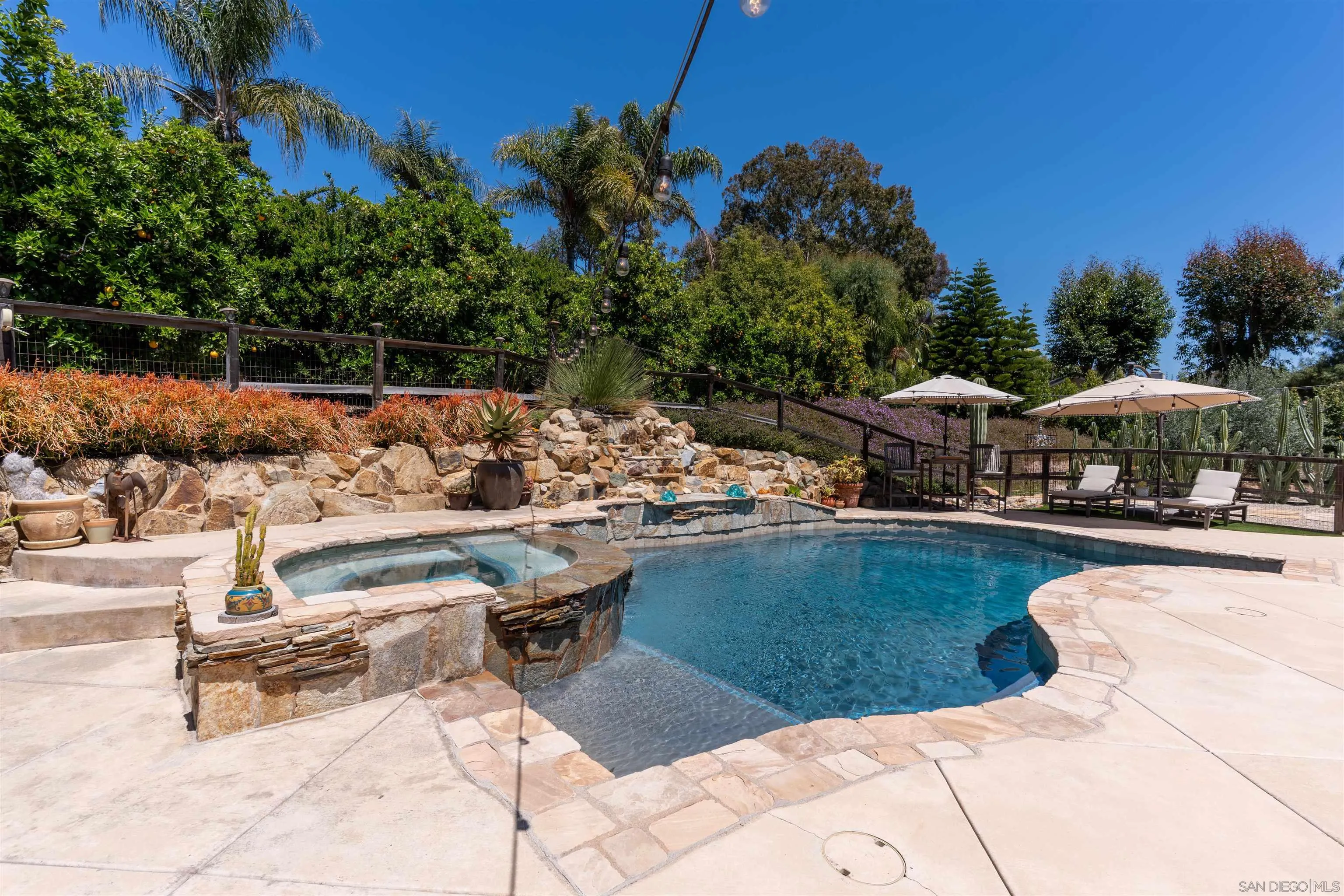 1045 Capra Way Fallbrook, CA 92028 - Photo 30 of 44 a view of swimming pool and lounge chair
