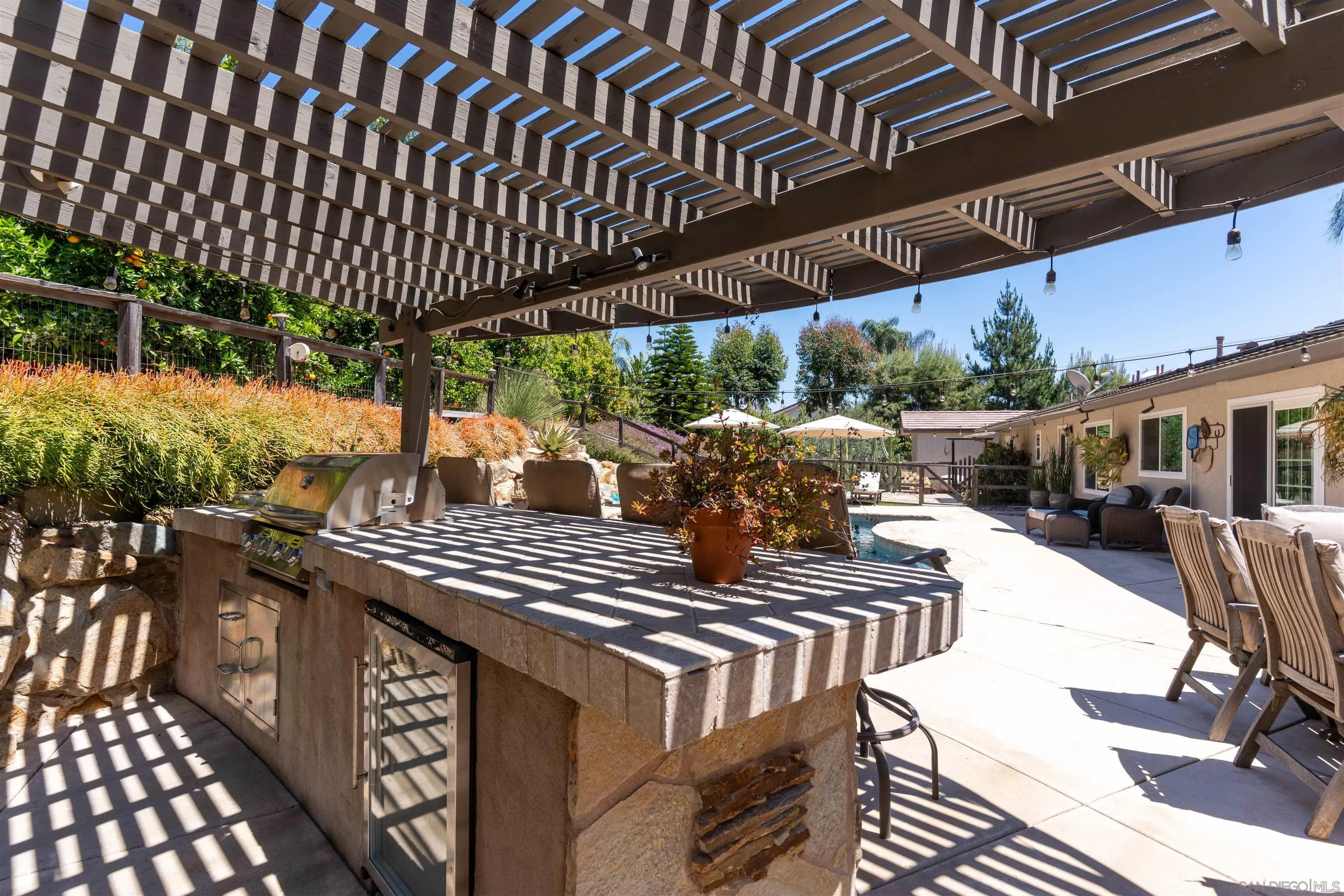 1045 Capra Way Fallbrook, CA 92028 - Photo 33 of 44 a view of a chairs and table in the patio